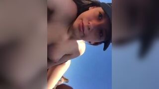 cute teen just flashing her perfect boobs at the beach
